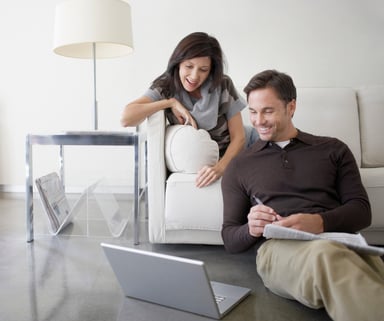 Couple using laptop