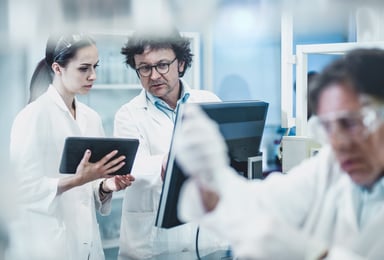 team of scientists work in lab