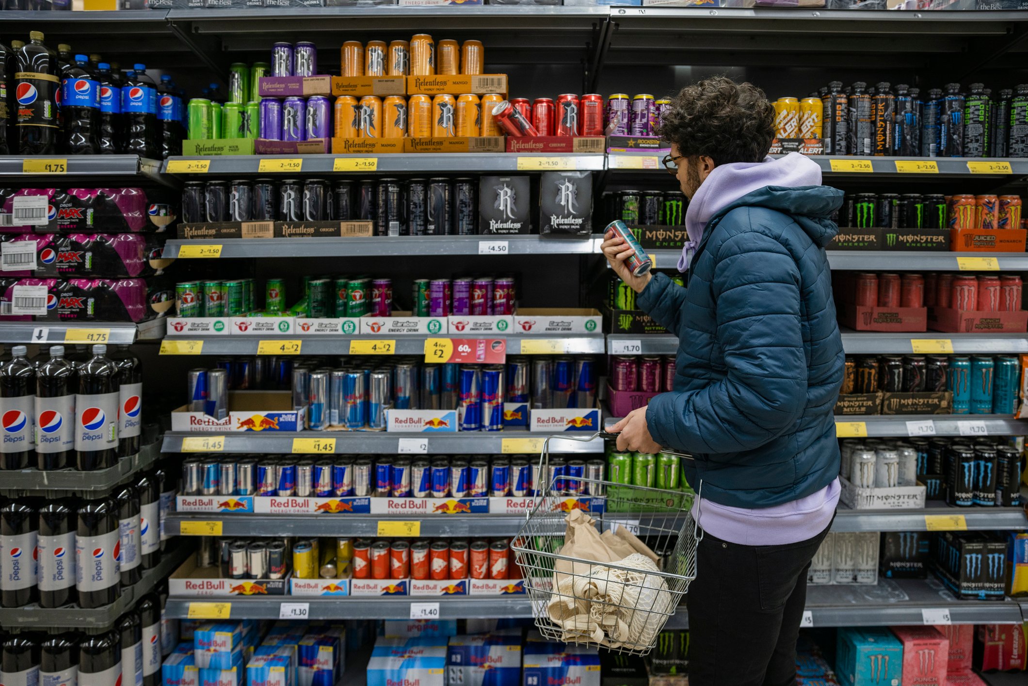person shopping for energy drinks