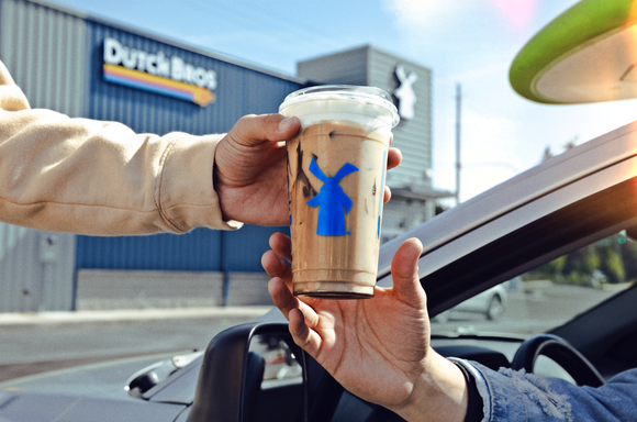 A customer receiving an order at Dutch Bros.