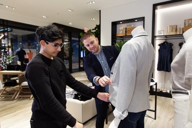Two Gap employees fixing a display in a store
