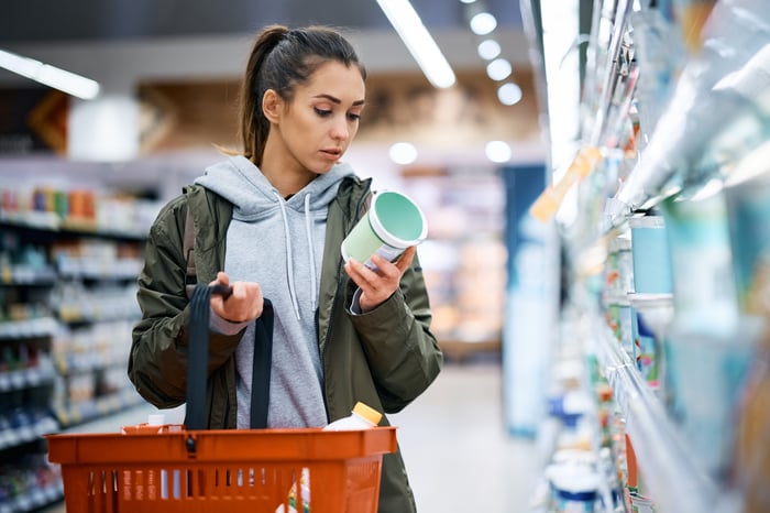 A person shops at a grocery store.