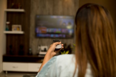 person watching connected TV
