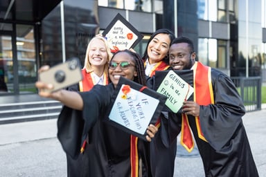 Students after graduation ceremony taking selfie