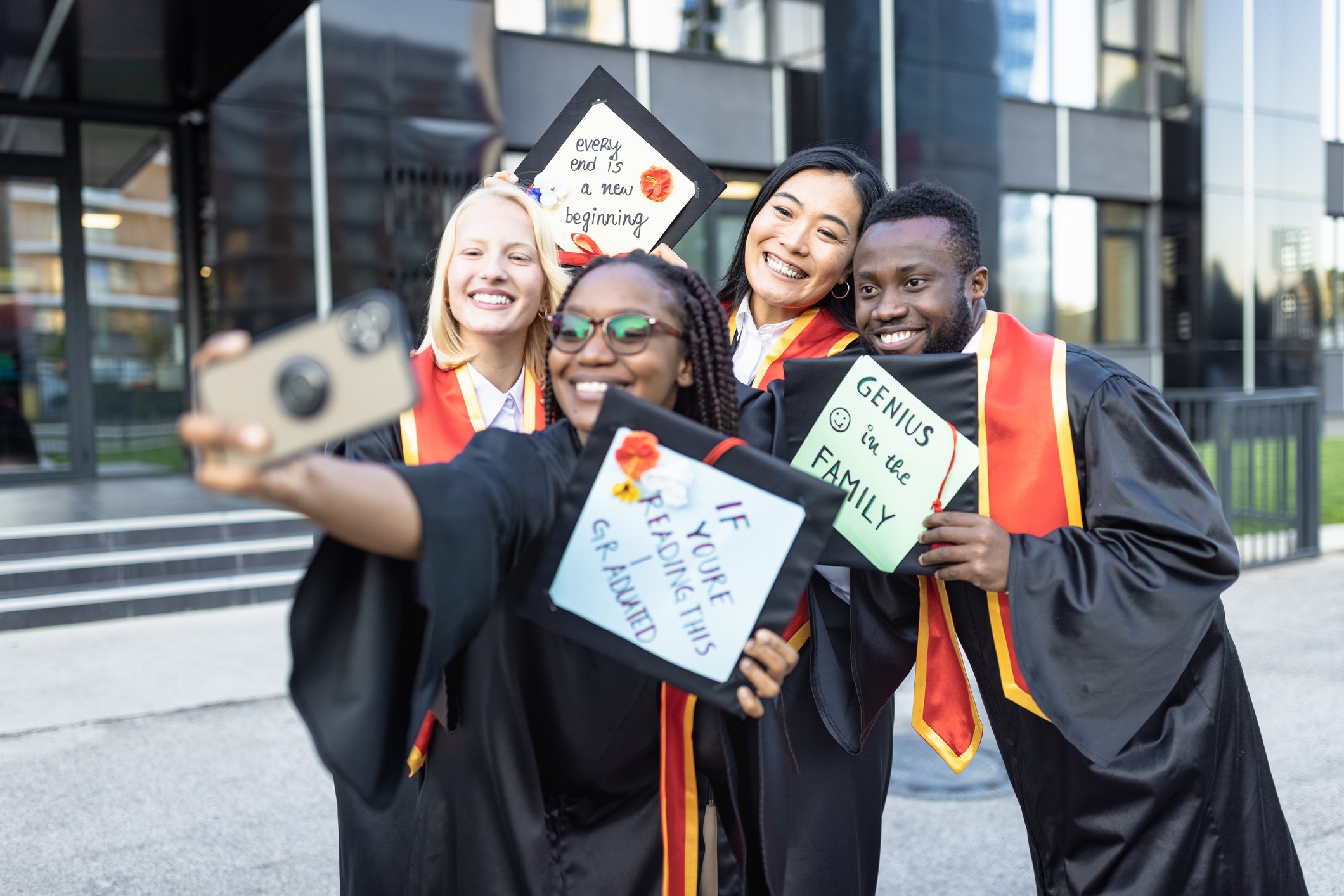 Students after graduation ceremony taking selfie