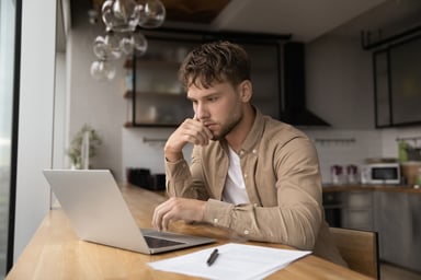Man 20s laptop GettyImages-1372785536