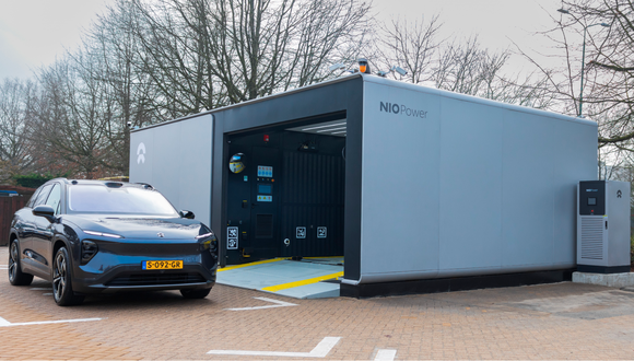 Nio vehicle in front of battery swapping station. 