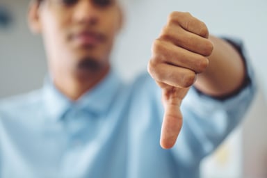 Person giving a thumbs down.