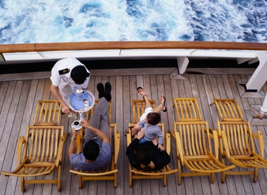 People on a ship deck drinking