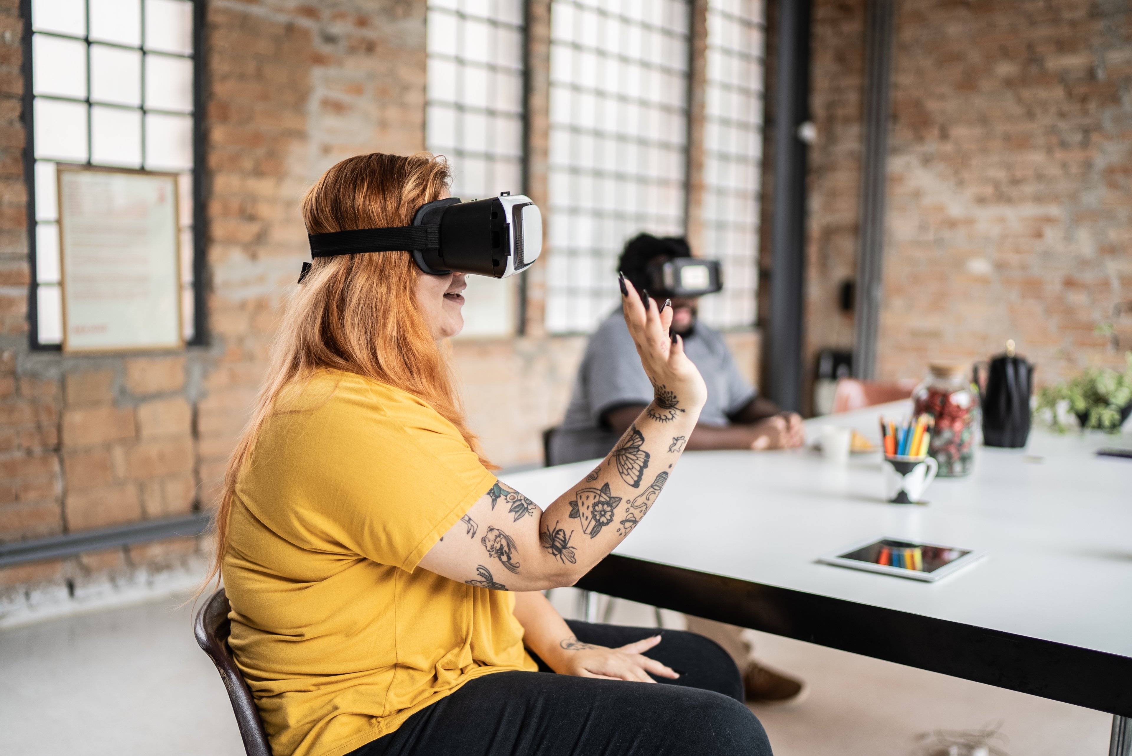 A person interacting with virtual reality on a headset.