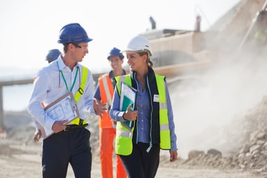 Engineers walking at a mine site.