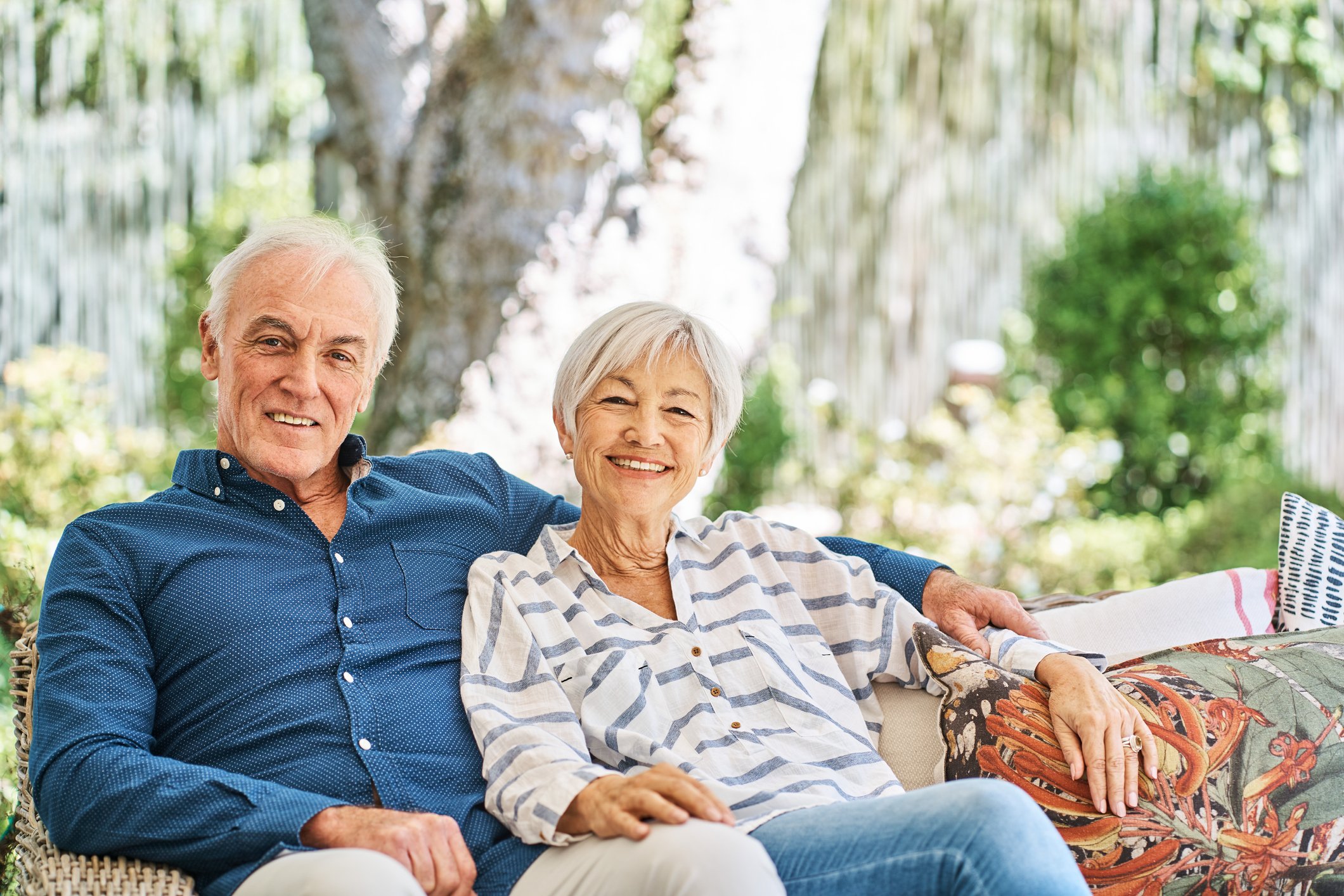 Two people sitting outdoors.