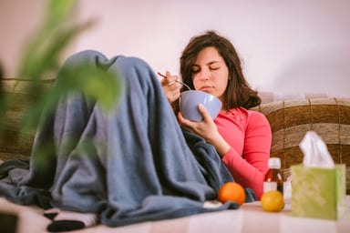 person eating soup as comfort food