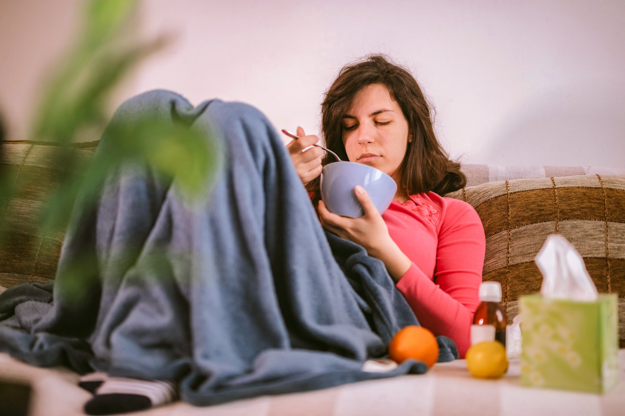 person eating soup as comfort food