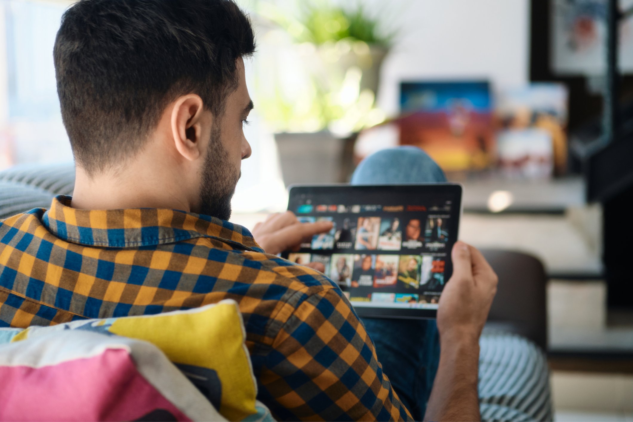nflx stock earnings person streaming