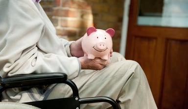 wheelchair and piggy bank