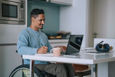 Man in wheelchair laptop