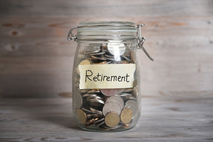 A jar of coins labeled Retirement.