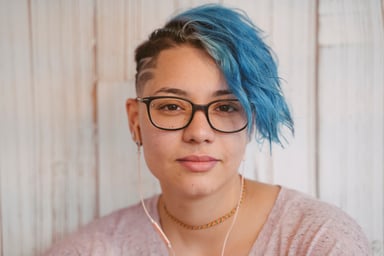 Getty - blue hair slight smile serious millennial
