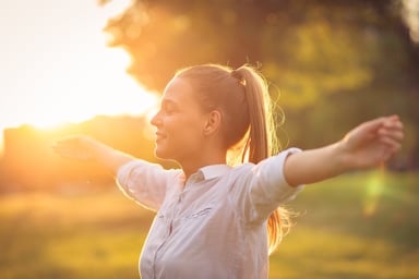 stretching out arms in the sun