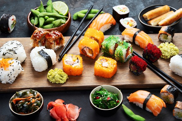 A board featuring different kinds of sushi.