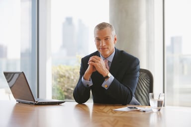 man biz suit desk GettyImages-107430162