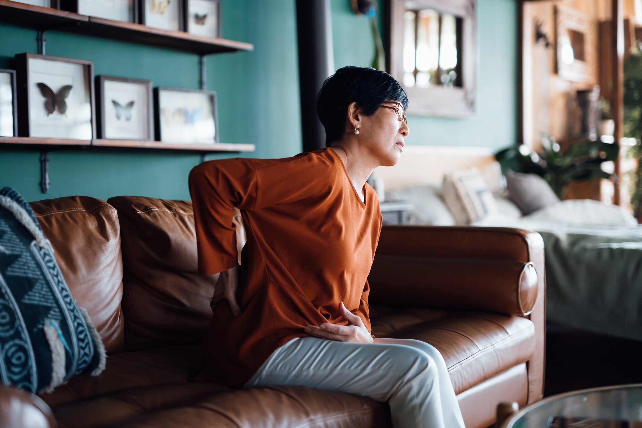 Person experiencing back pain (1)