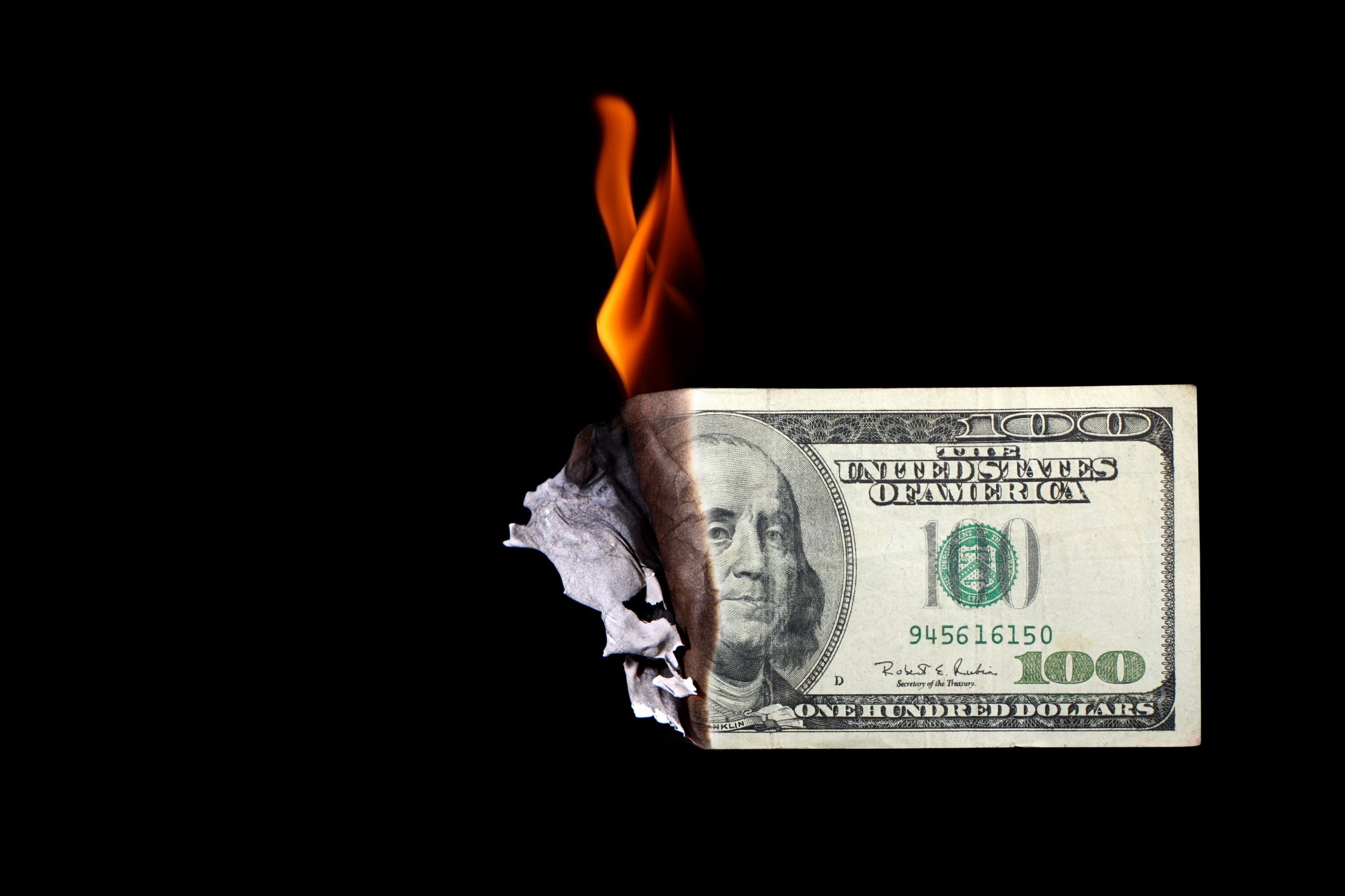 A 100 dollar bill aflame