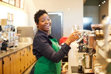 Person making coffee at Starbucks