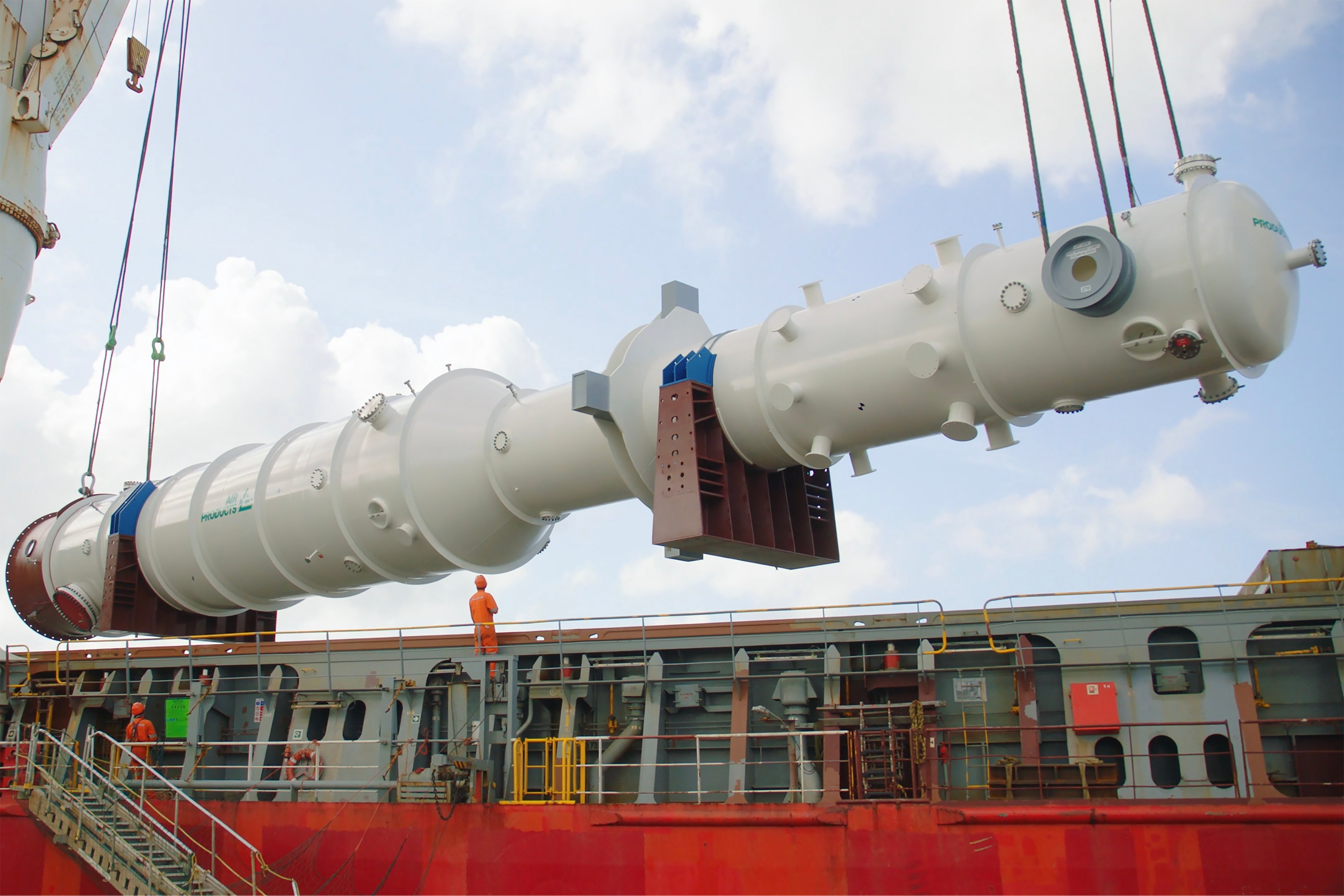 A completed LNG heat exchanger manufactured at Air Products' Port Manatee, Florida, facility is being loaded on a carrier at the Port of Manatee for shipment to the customer.