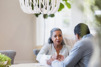 senior couple at table GettyImages-1391105721