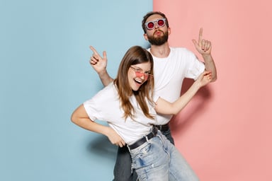 two people wearing jeans dancing