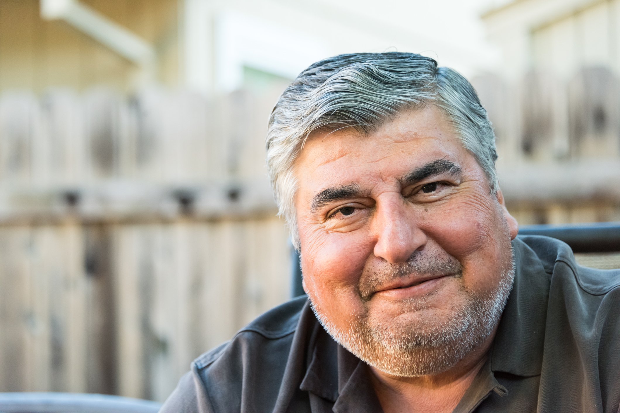 A person smiling and facing the camera.