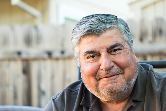 A person smiling and facing the camera.