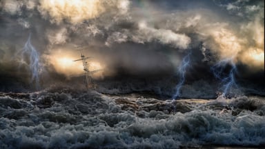 Sailing vessel in stormy seas.