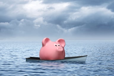piggy bank on boat at sea