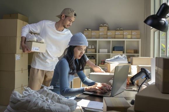 A small business merchant processing orders.