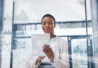 African-American woman looking at tablet