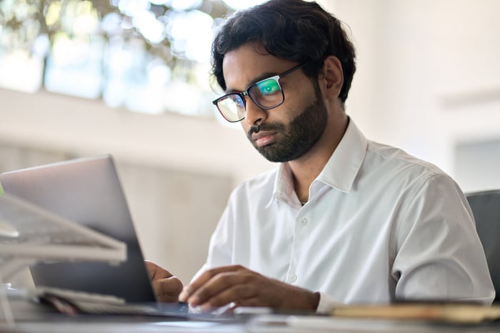 A person at a laptop.