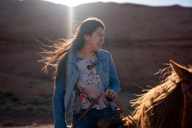 woman riding horse outside nature animal 