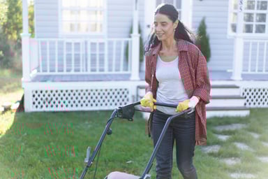 Person mowing a lawn