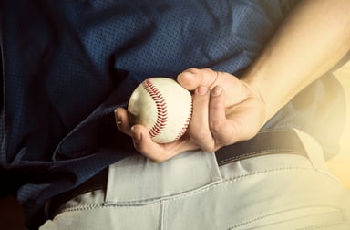 Baseball behind the back of a pitcher