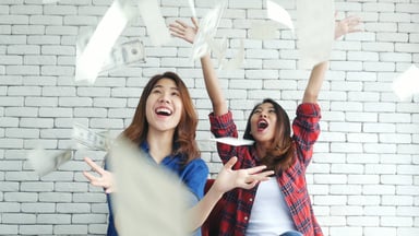 friends celebrating windfall cash dividends