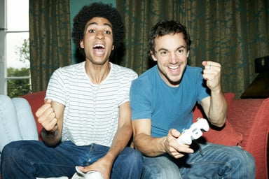 Friends playing video game winning