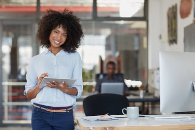 a marketing employee works from a tablet