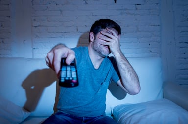 scared man watching tv streaming