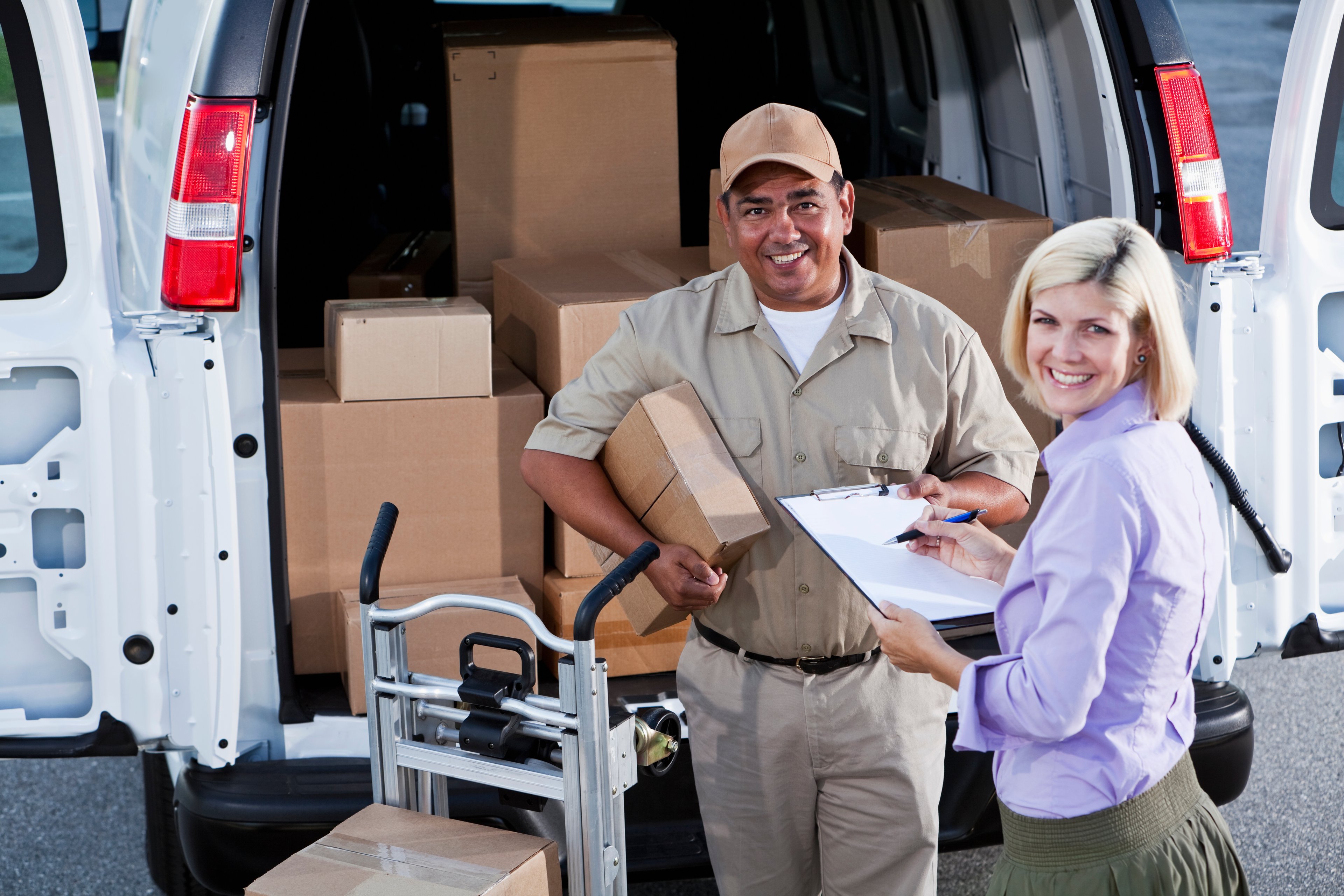 Person signing for a package delivery.