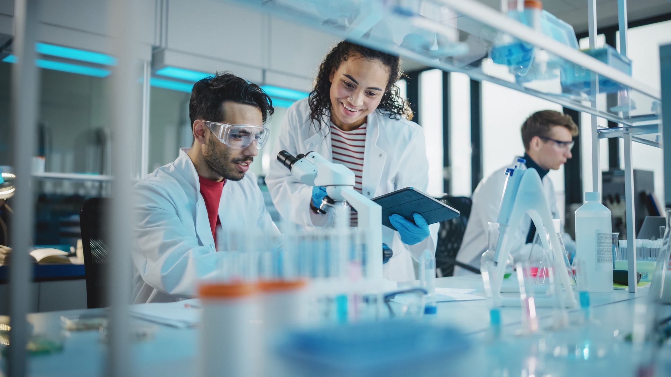 3 scientists at work in lab