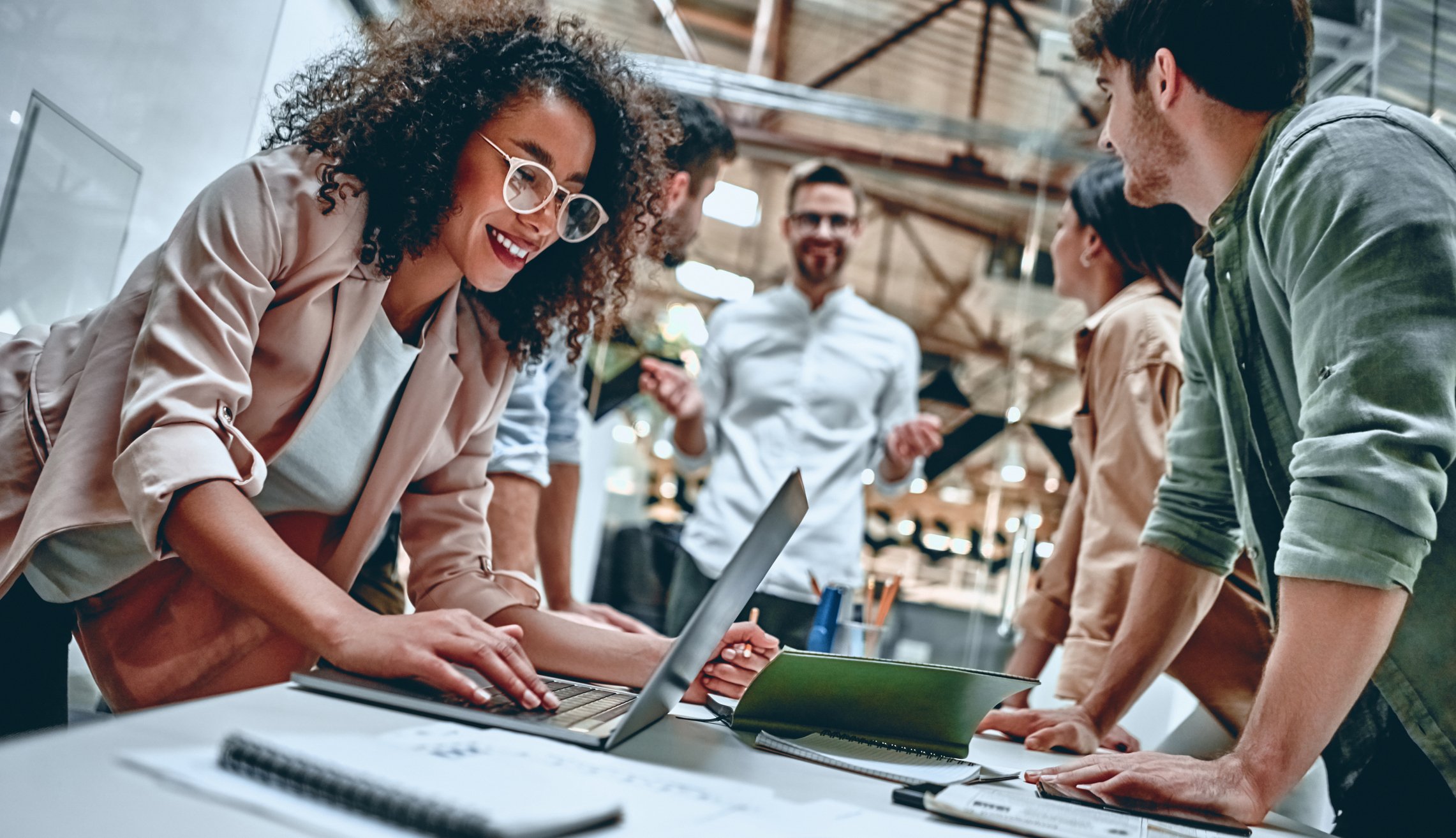 Young happy professionals in office