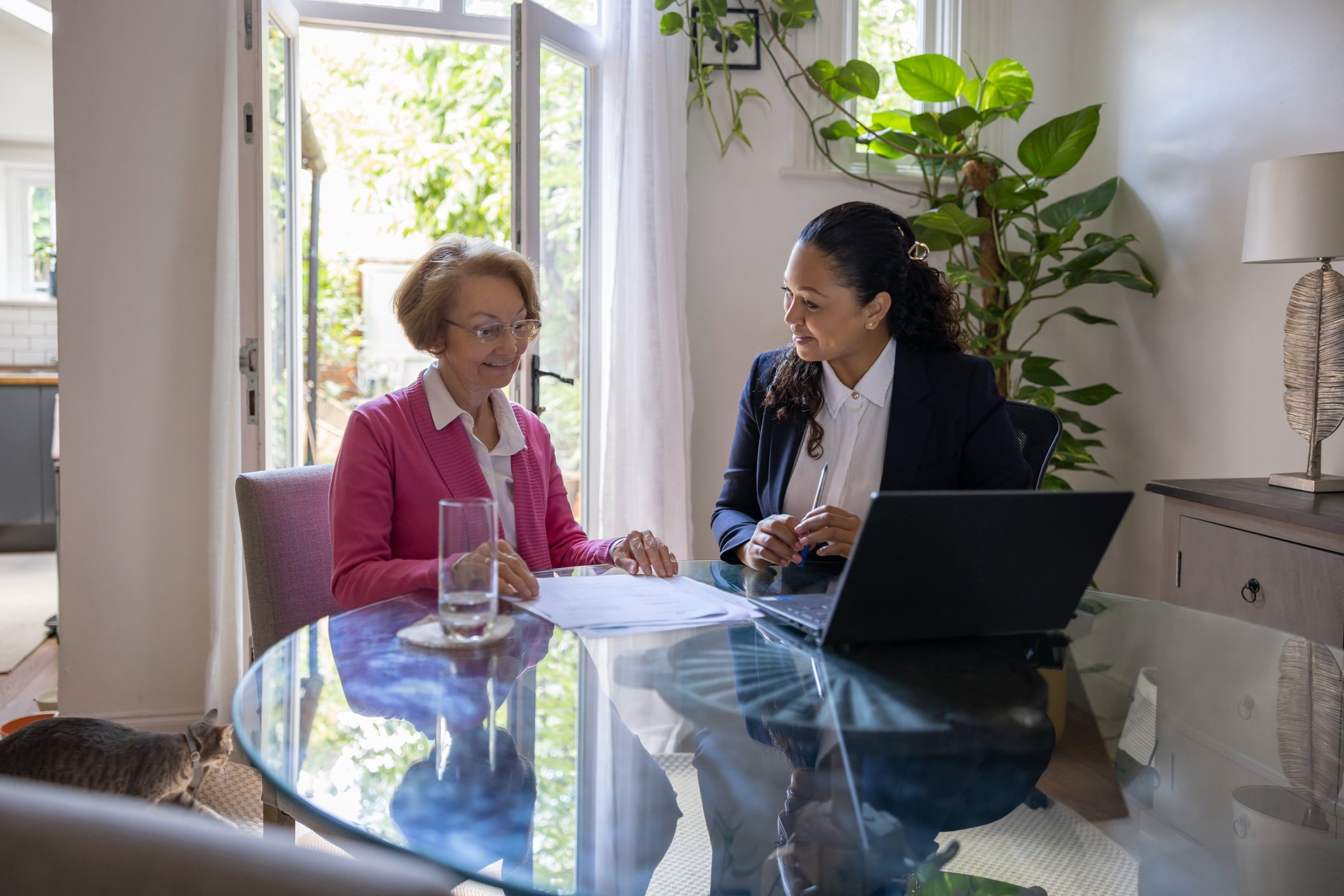 An advisor working with a client in a home.